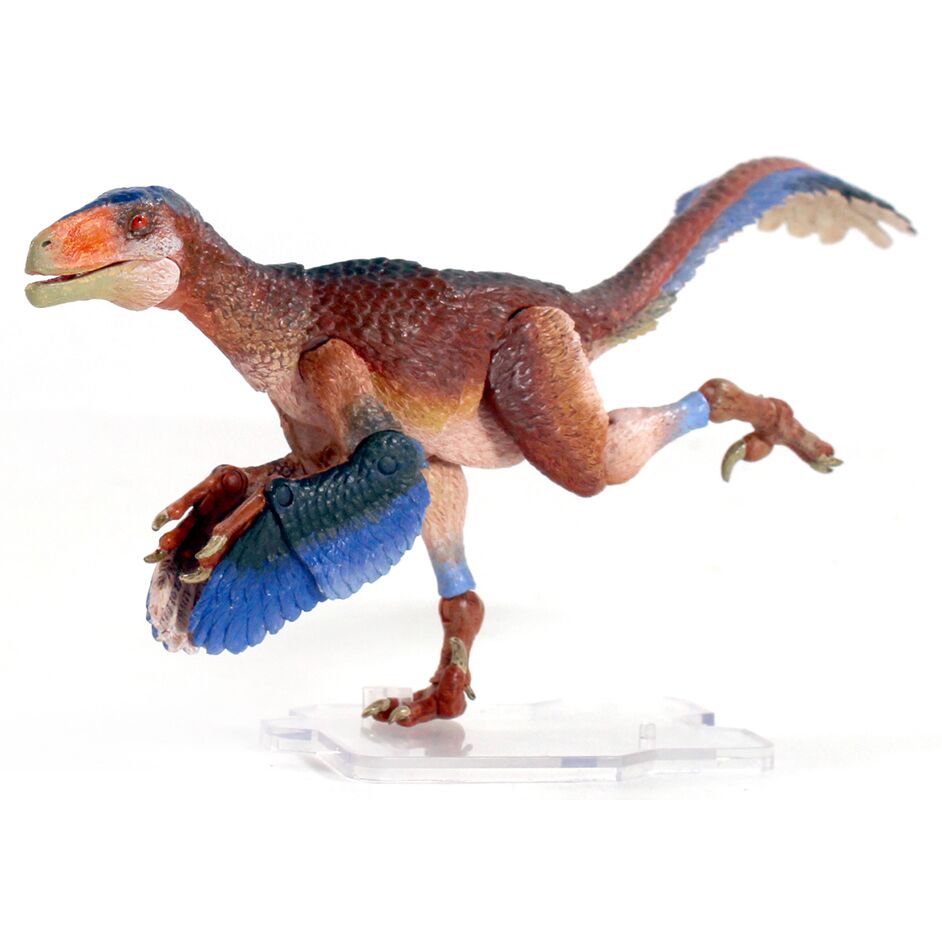 A running dromaeosaurid figure.